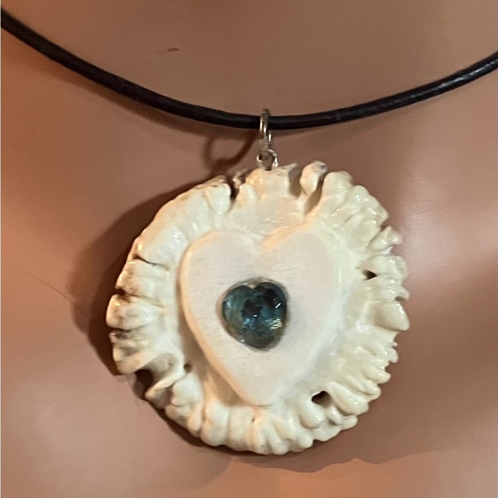 Naturally Shed Deer Antler Pendant
Hand Carved Heart/Blue Topaz
No Cord Included